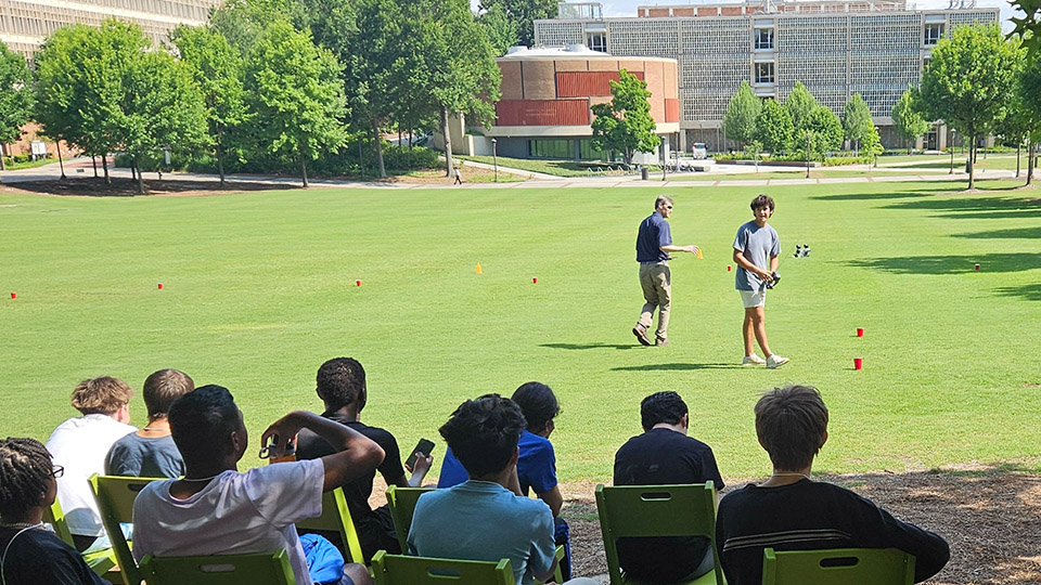 Student working on a remote controlled car during Energy Unplugged Georgia Tech Summer Camp for High school students 