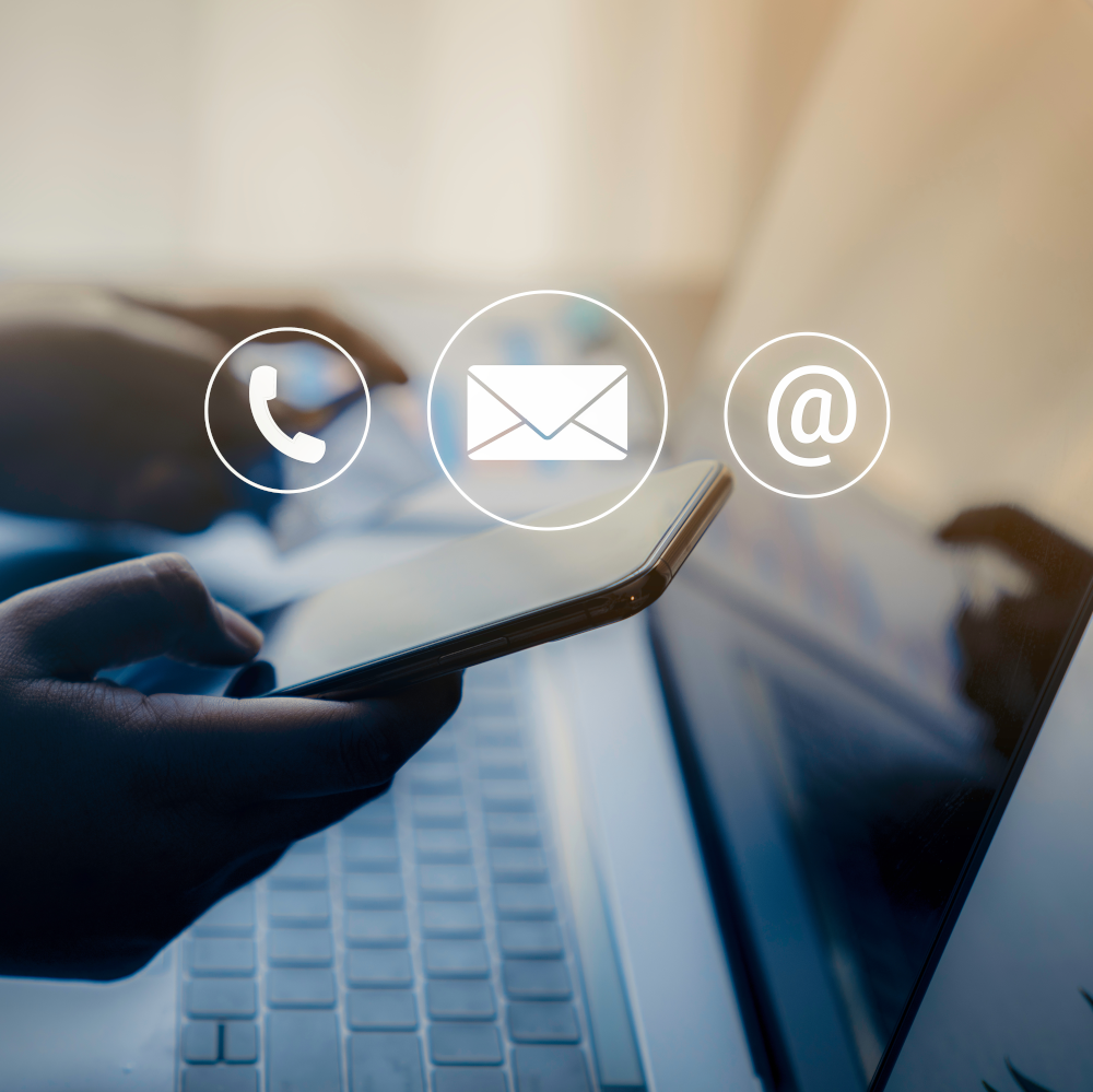 Phone and Mail icons in front of keyboard and phone