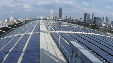 Solar power arrays in front of a city